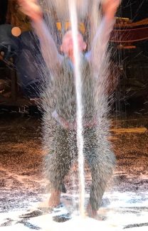 Terres Neuves Consulting man throwing rice
